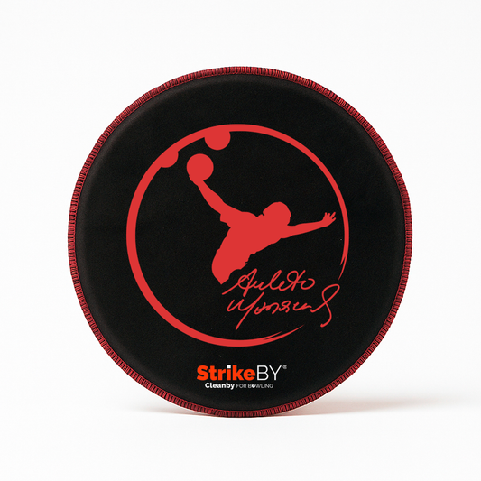 Black shammy with red logo of Amleto Monacelli and 'Strike BY' branding on a white background