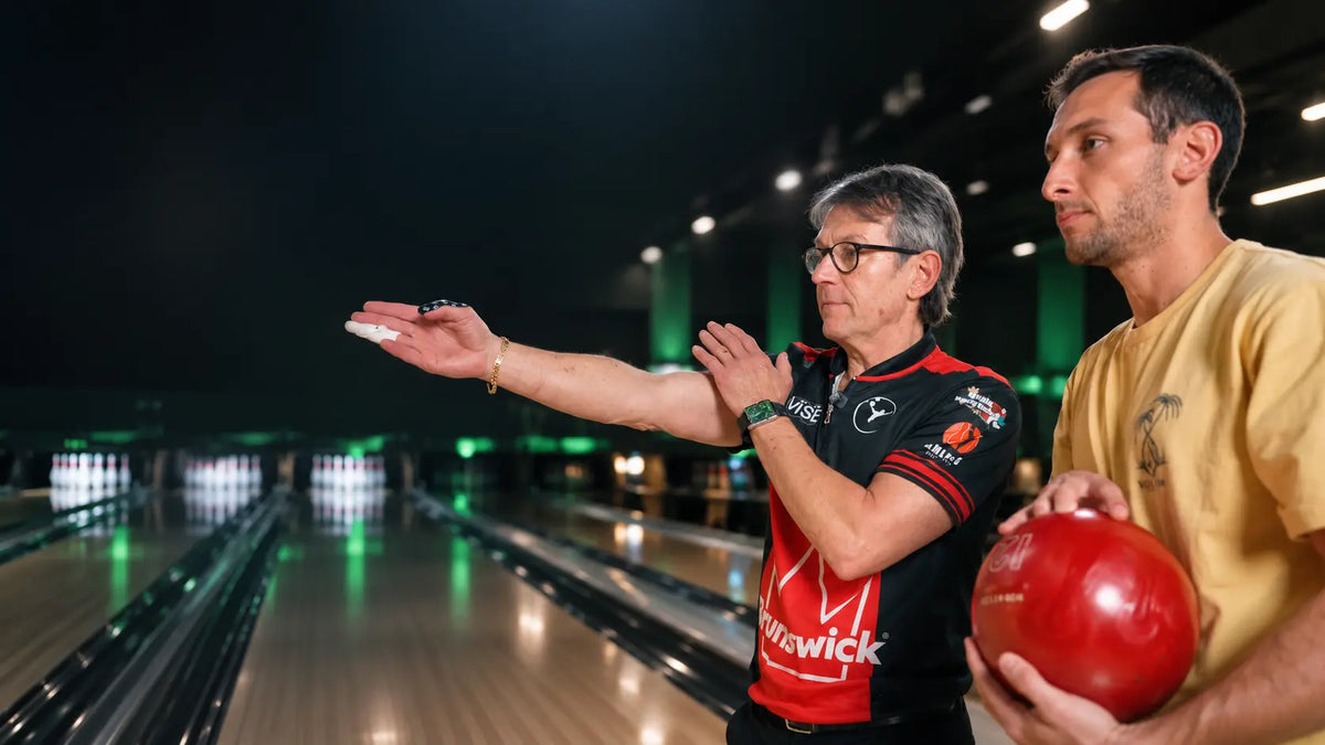 Amleto Monacelli coaching a bowler during a private lesson.